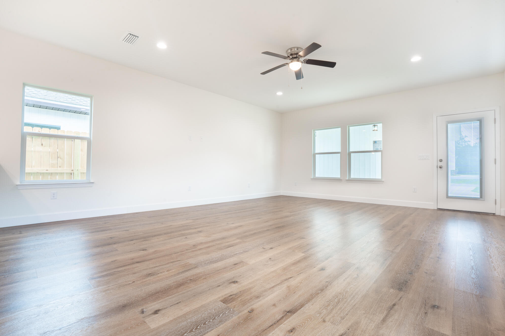 21 B 5th Avenue Shalimar, FL 32579 - Photo 4 of 21 wooden floor in an empty room with a window