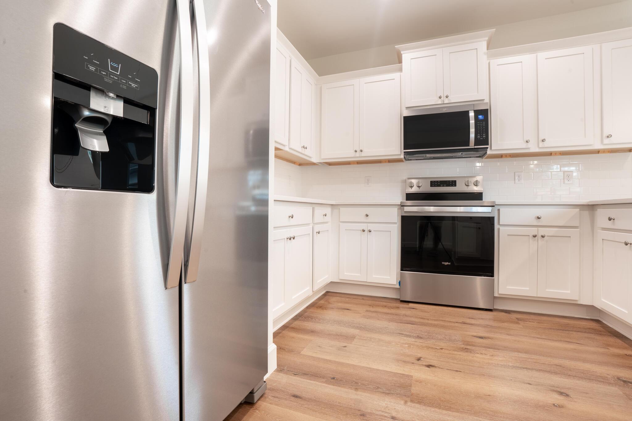 21 B 5th Avenue Shalimar, FL 32579 - Photo 8 of 21 a kitchen with stainless steel appliances a stove a microwave and cabinets