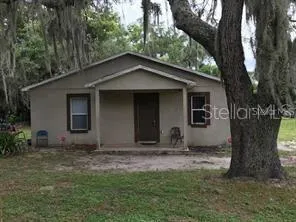 a house with trees in the background