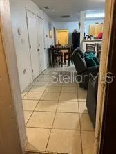 a view of kitchen with furniture and natural light