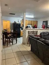 a kitchen with stainless steel appliances a stove a sink a counter top space and cabinets