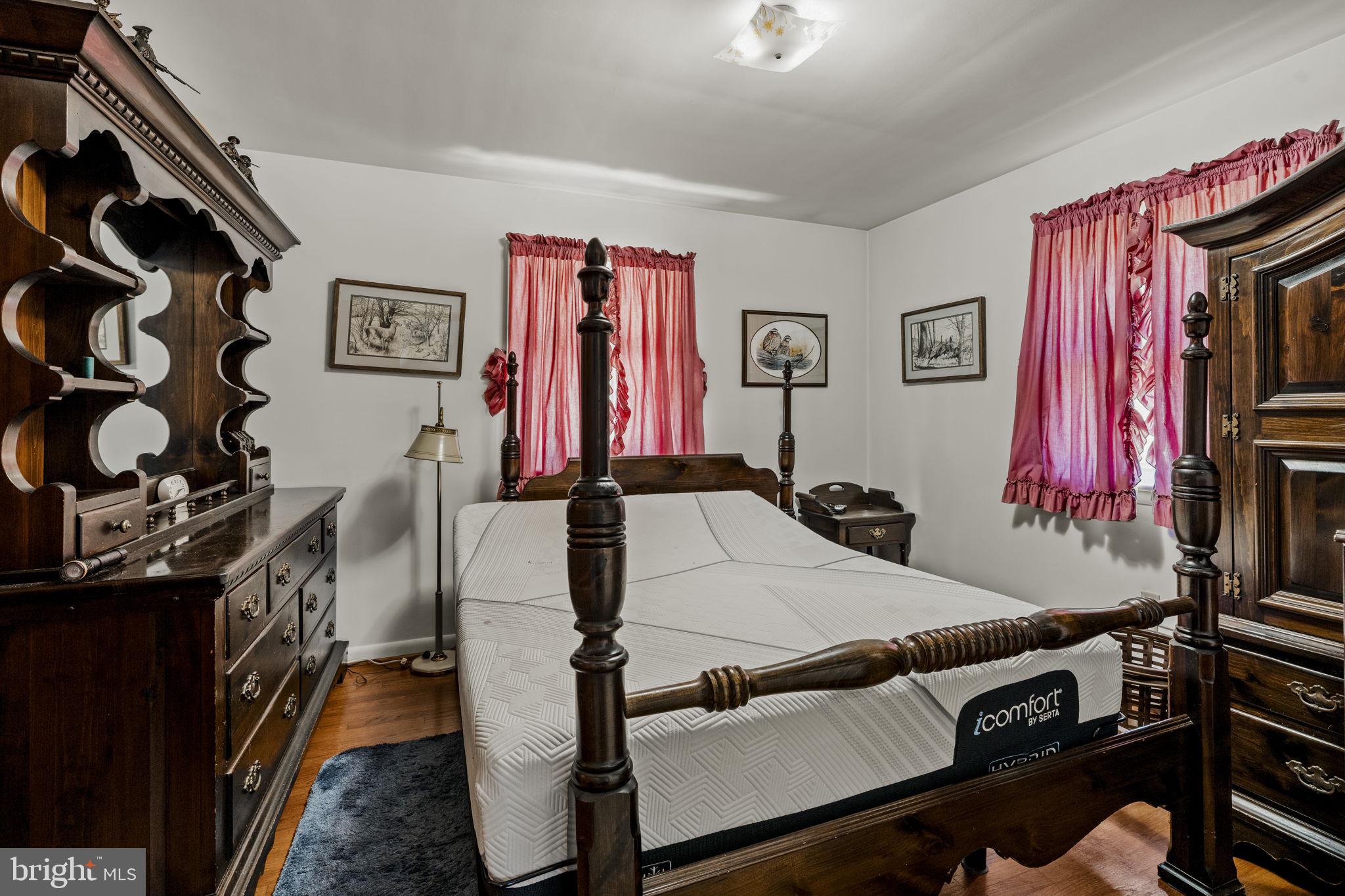 462 Sawmill Road New Providence, PA 17560 - Photo 15 of 26 a bed room with a bed and a flat tv screen