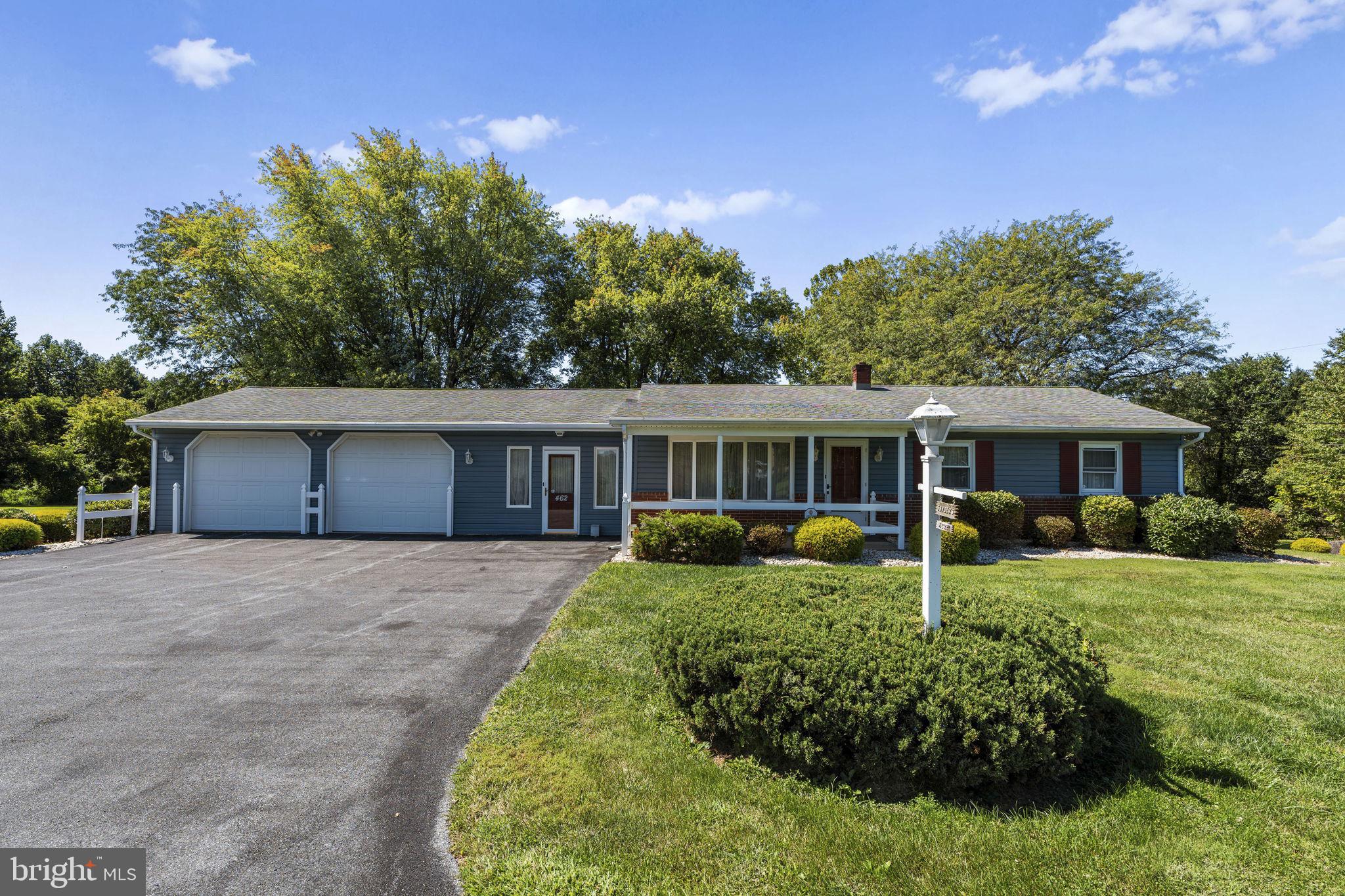 462 Sawmill Road New Providence, PA 17560 - Photo 2 of 26 a front view of a house with a garden