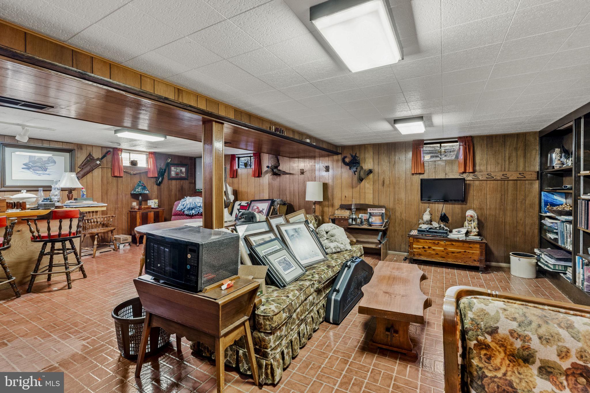 462 Sawmill Road New Providence, PA 17560 - Photo 22 of 26 a living room with furniture and a flat screen tv