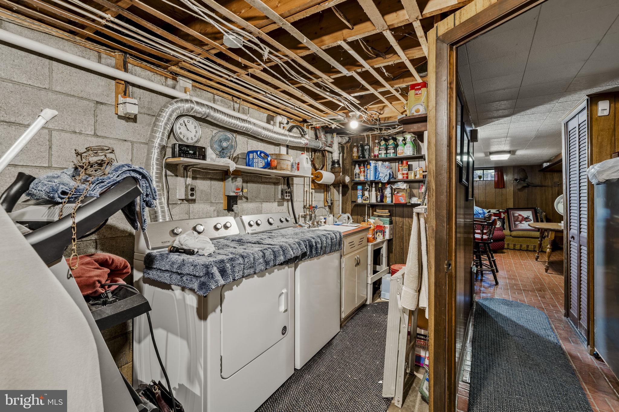 462 Sawmill Road New Providence, PA 17560 - Photo 24 of 26 a storage room with washer and dryer