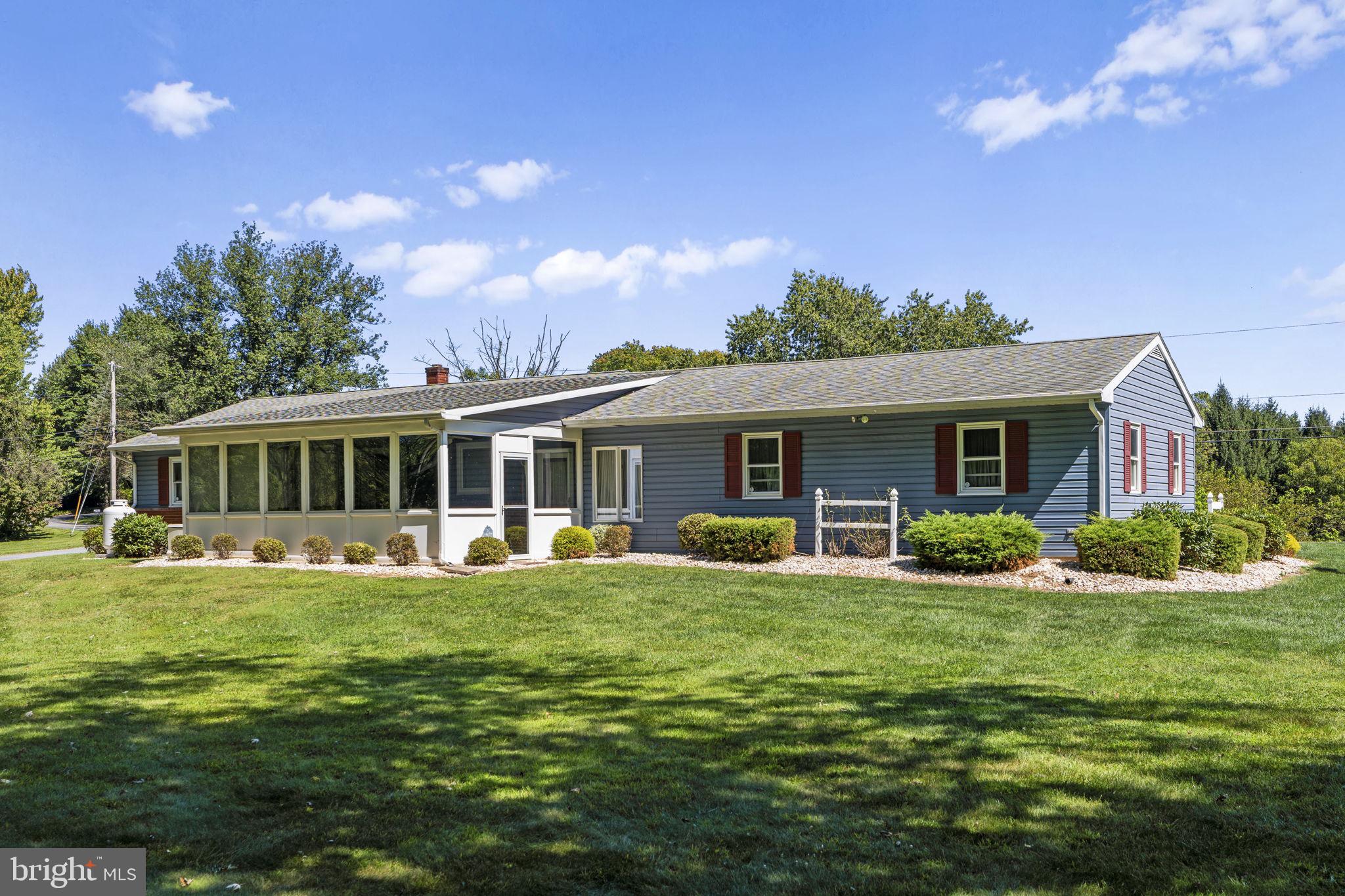 462 Sawmill Road New Providence, PA 17560 - Photo 4 of 26 a front view of a house with a garden