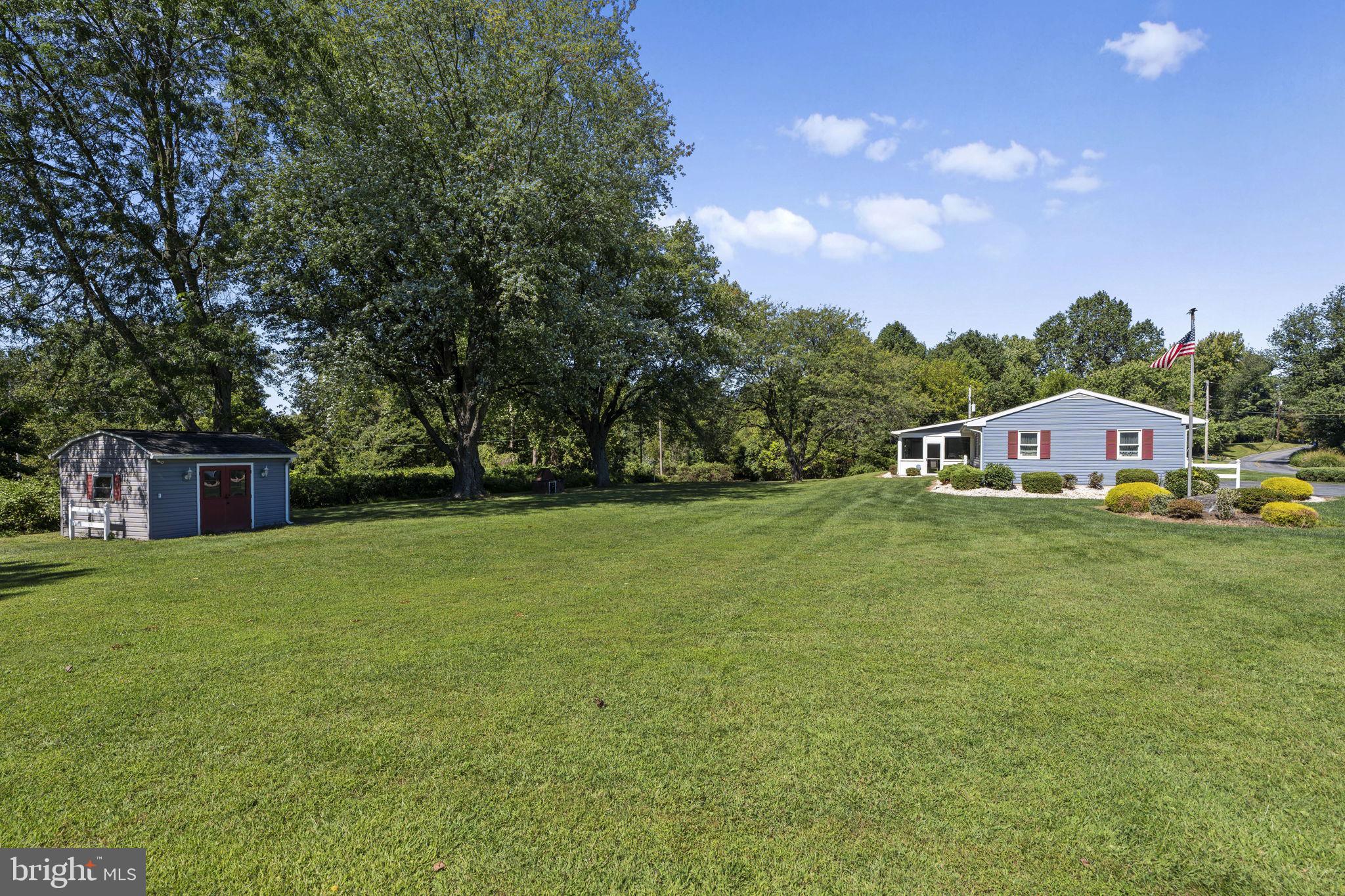462 Sawmill Road New Providence, PA 17560 - Photo 5 of 26 a front view of house with yard and trees