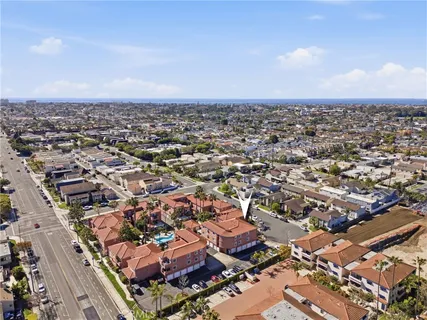 an aerial view of residential houses with city view