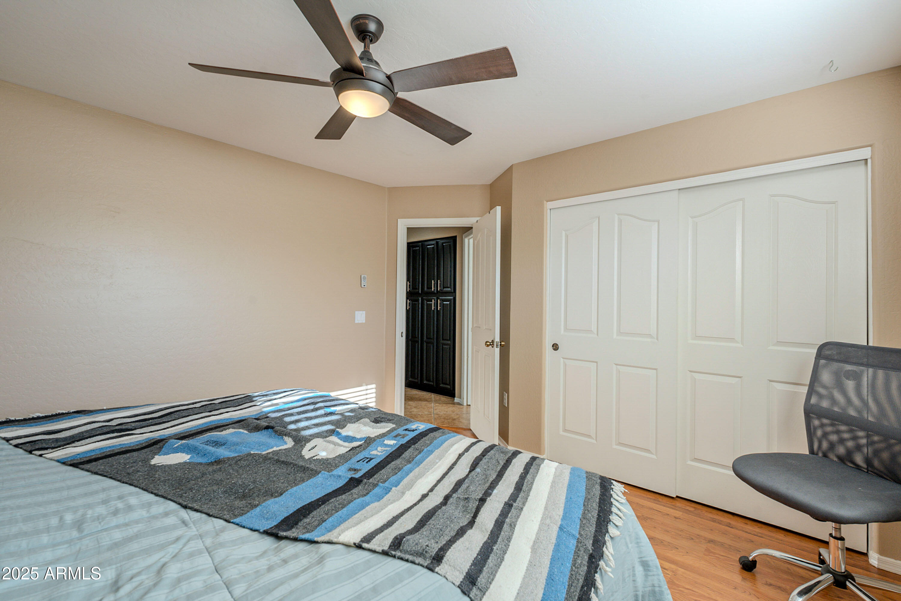 3464 North Ashbrook Mesa, AZ 85213 - Photo 20 of 63 a bedroom with a bed and a chandelier