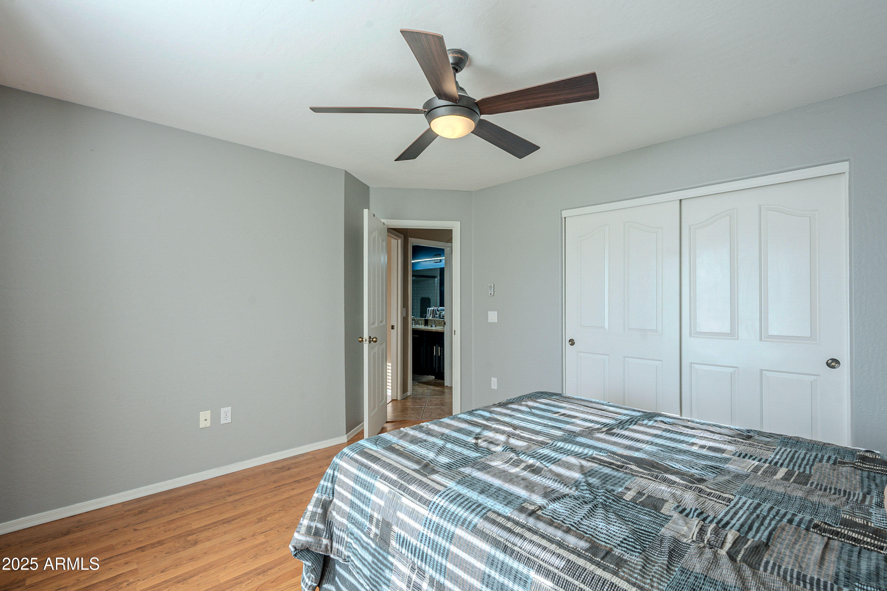 3464 North Ashbrook Mesa, AZ 85213 - Photo 22 of 63 a bedroom with a bed and a ceiling fan