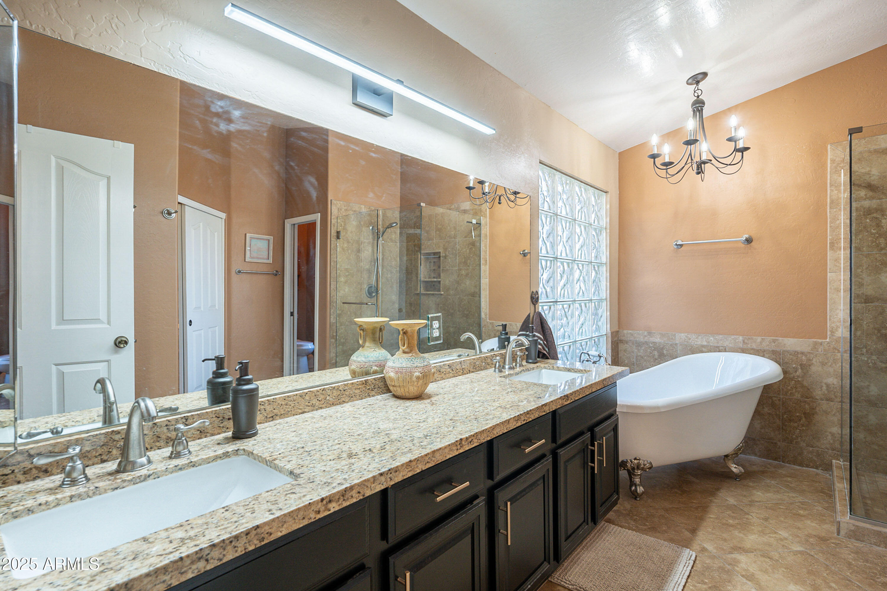 3464 North Ashbrook Mesa, AZ 85213 - Photo 26 of 63 a bathroom with a granite countertop sink a toilet a mirror and shower