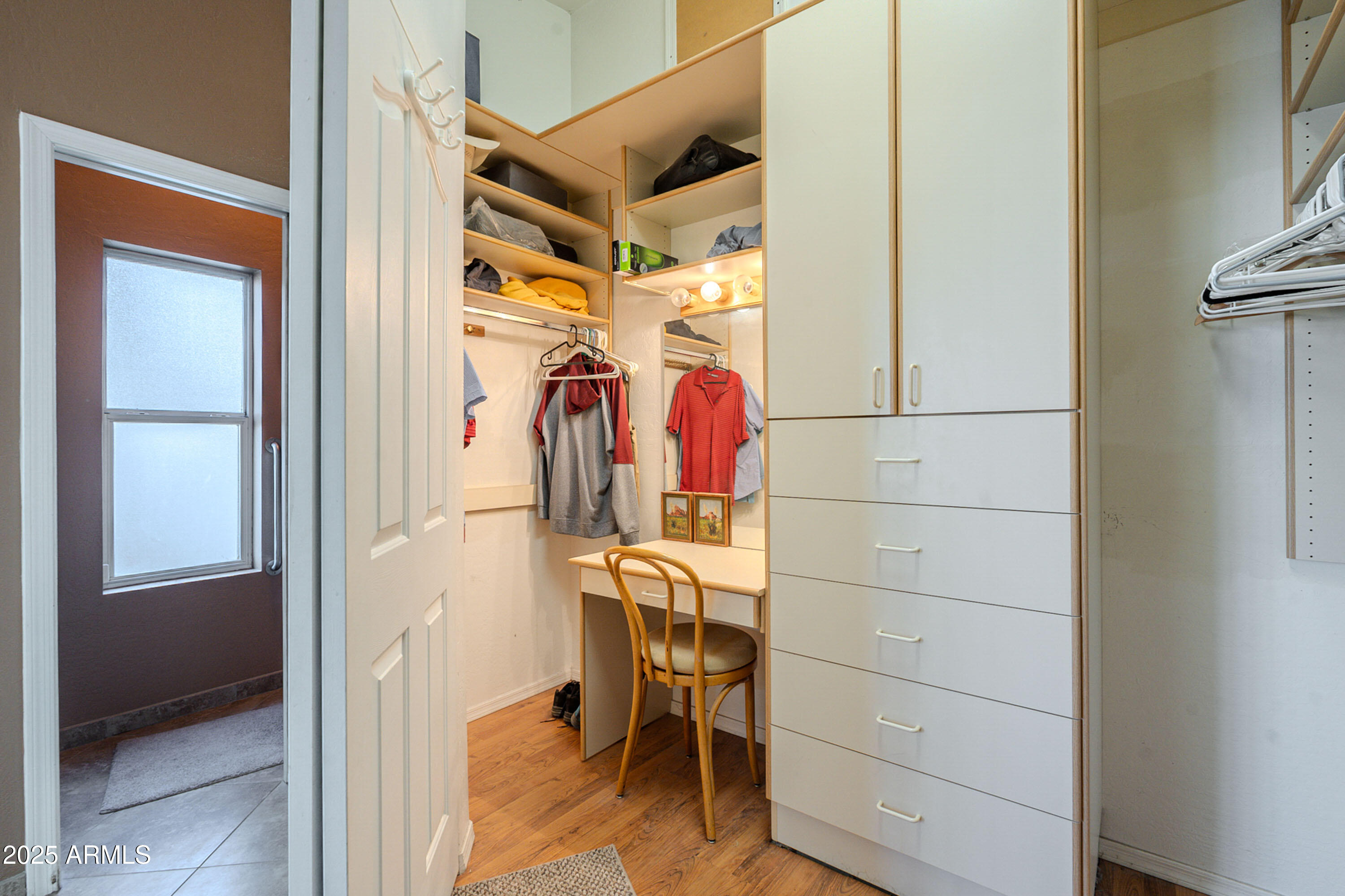 3464 North Ashbrook Mesa, AZ 85213 - Photo 28 of 63 a view of walk in closet with clothes and shoes