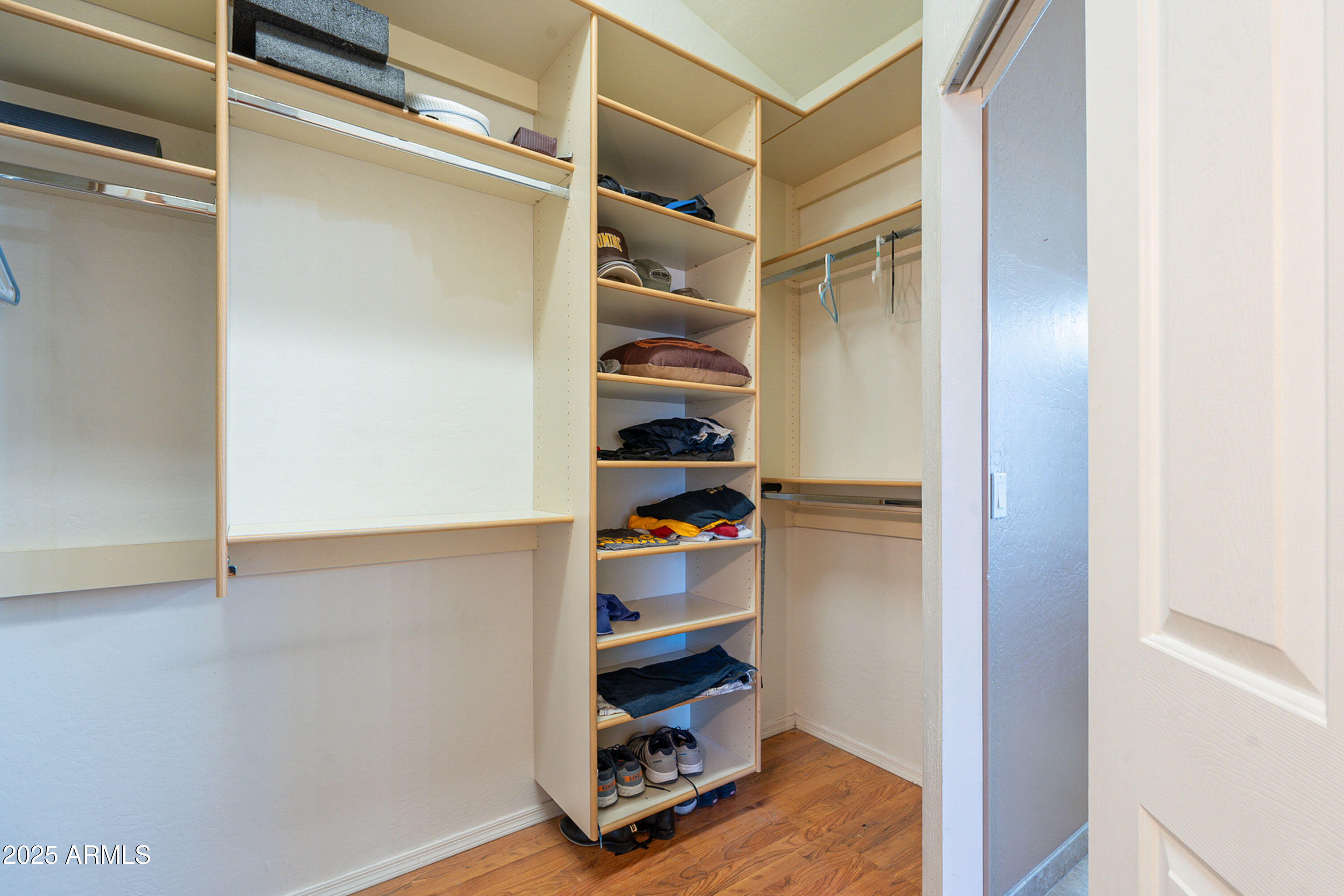 3464 North Ashbrook Mesa, AZ 85213 - Photo 29 of 63 a view of walk in closet with empty racks