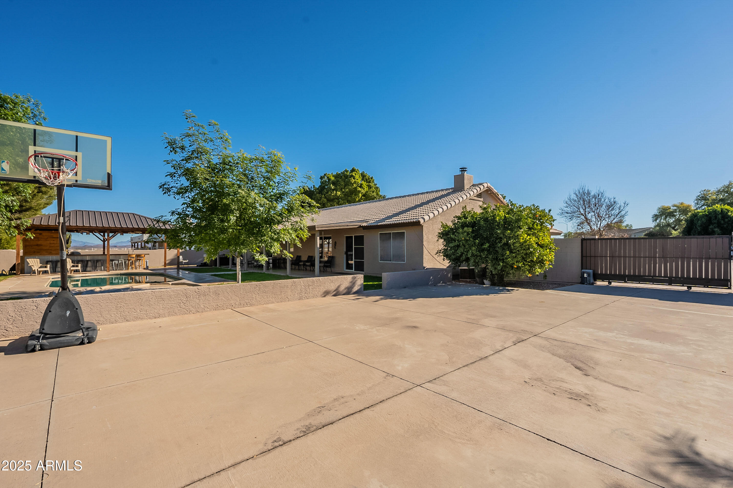 3464 North Ashbrook Mesa, AZ 85213 - Photo 30 of 63 a front view of a house with a yard and a garage