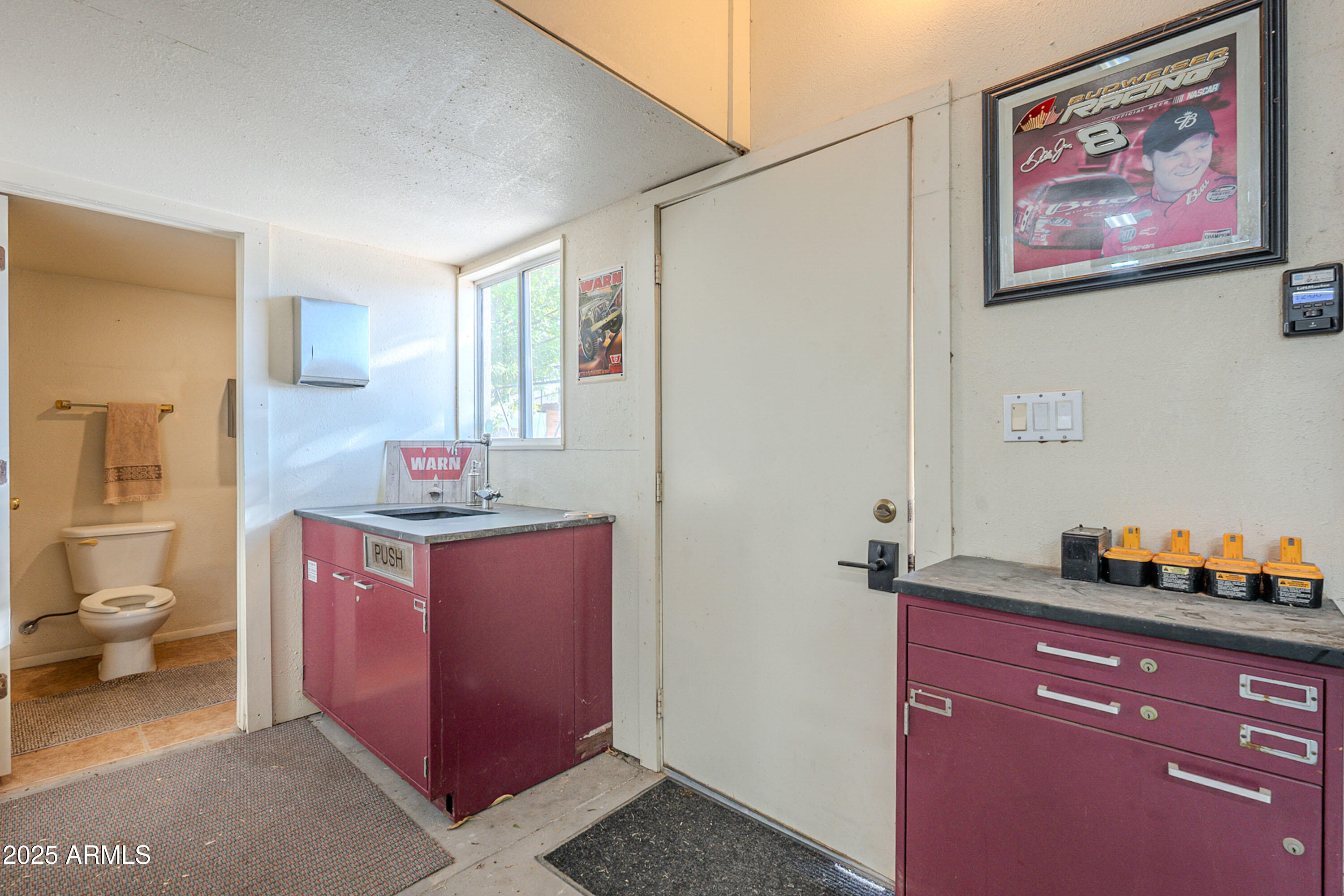 3464 North Ashbrook Mesa, AZ 85213 - Photo 33 of 63 a hall with a stove and a cabinet
