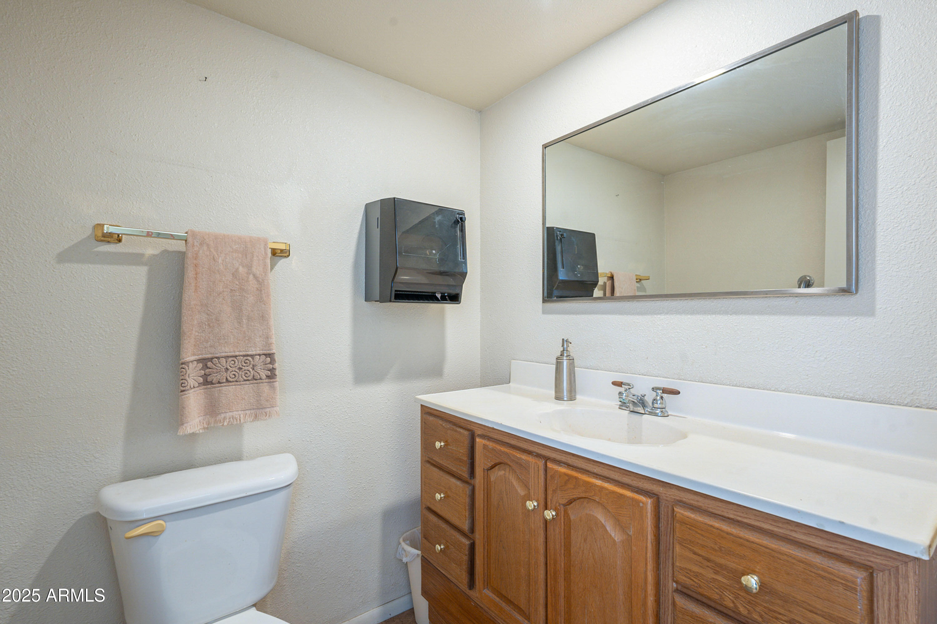 3464 North Ashbrook Mesa, AZ 85213 - Photo 34 of 63 a bathroom with a sink a toilet and mirror
