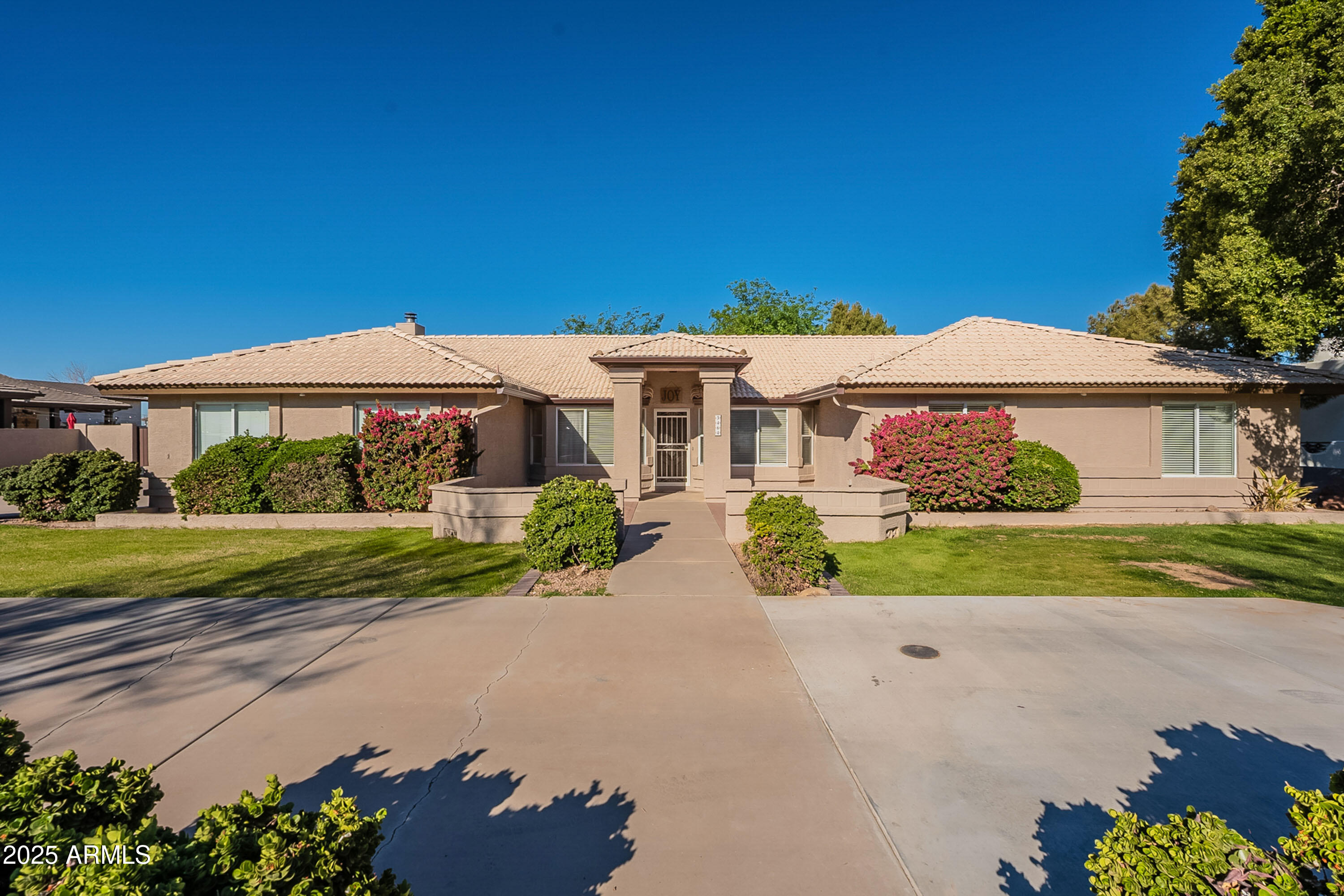 3464 North Ashbrook Mesa, AZ 85213 - Photo 5 of 63 a front view of a house with a yard
