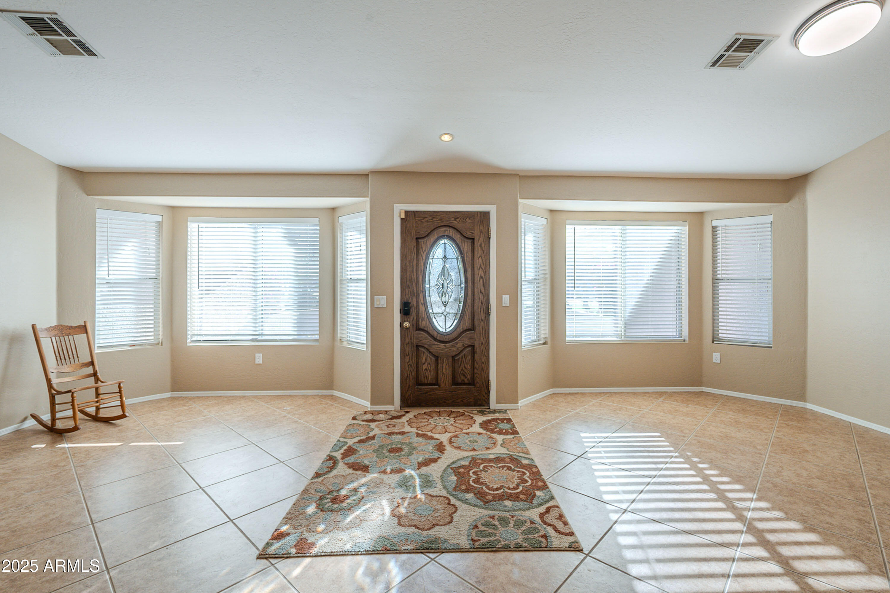 3464 North Ashbrook Mesa, AZ 85213 - Photo 6 of 63 a spacious bedroom with a large bed and a window
