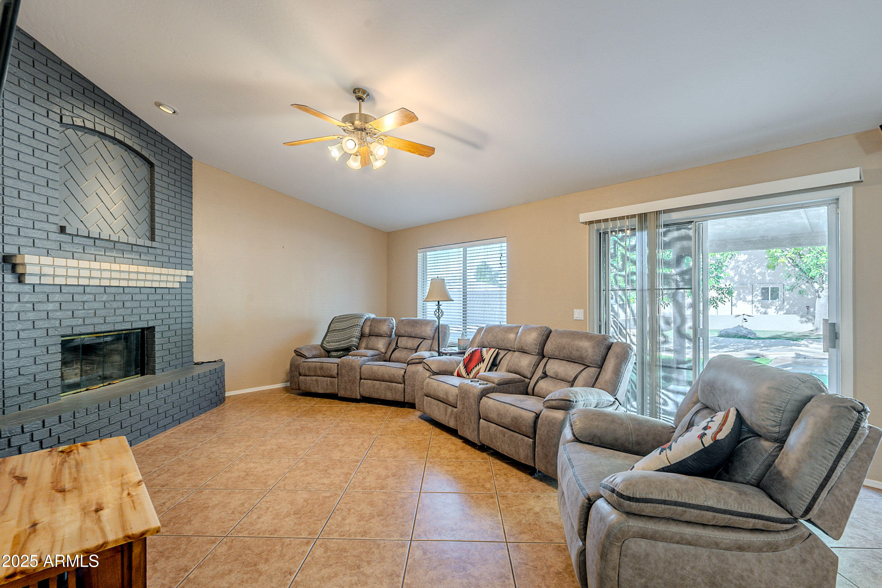 3464 North Ashbrook Mesa, AZ 85213 - Photo 8 of 63 a living room with furniture and a fireplace
