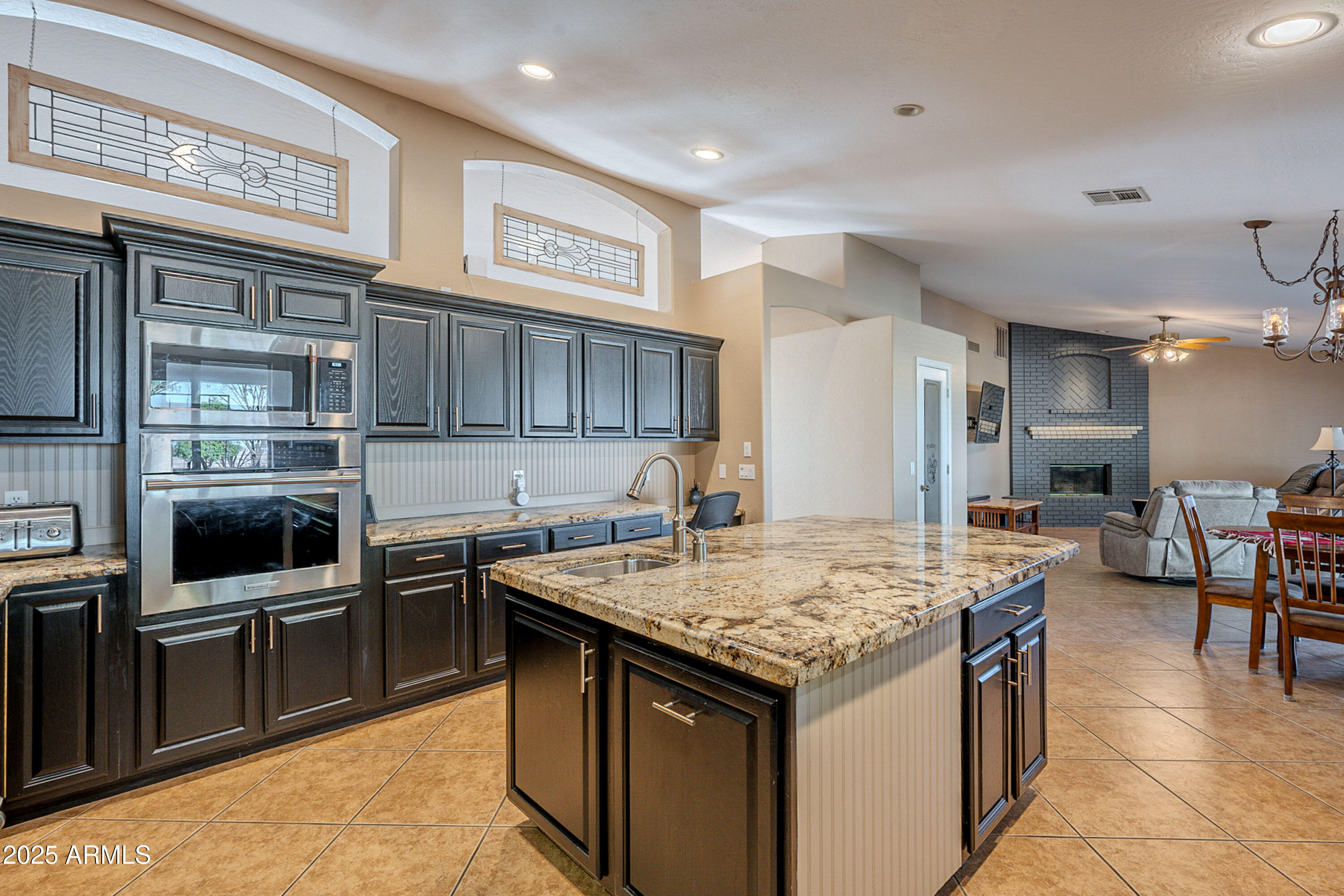 3464 North Ashbrook Mesa, AZ 85213 - Photo 10 of 63 a kitchen with a stove and a refrigerator