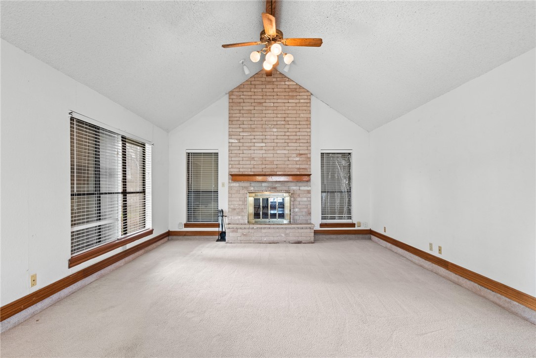 5309 Timbergate Drive Corpus Christi, TX 78413 - Photo 15 of 29 a view of an empty room with window and chandelier fan