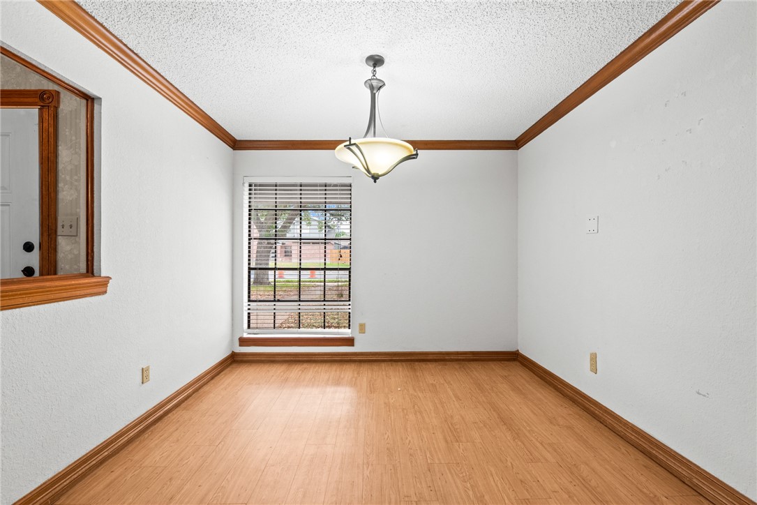 5309 Timbergate Drive Corpus Christi, TX 78413 - Photo 18 of 29 a view of empty room with wooden floor and fan
