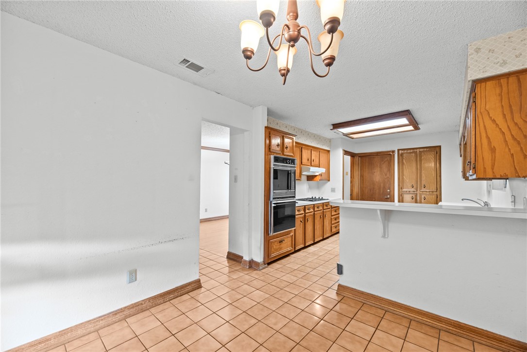 5309 Timbergate Drive Corpus Christi, TX 78413 - Photo 21 of 29 a view of a refrigerator and window in a room