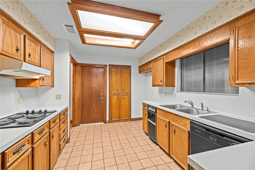 5309 Timbergate Drive Corpus Christi, TX 78413 - Photo 23 of 29 a kitchen with stainless steel appliances granite countertop a sink and a stove