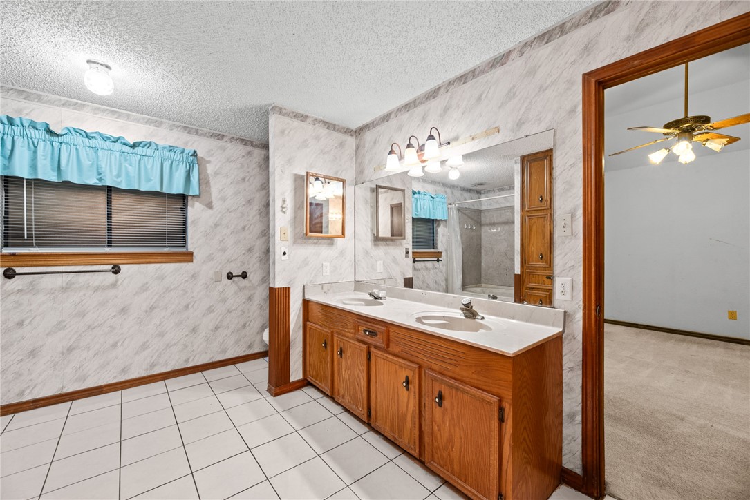 5309 Timbergate Drive Corpus Christi, TX 78413 - Photo 25 of 29 a spacious bathroom with a double vanity sink mirror and bathtub