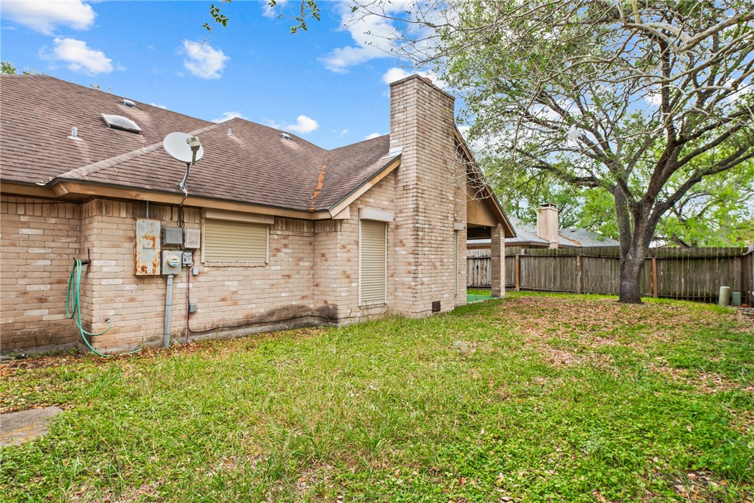 5309 Timbergate Drive Corpus Christi, TX 78413 - Photo 26 of 29 a backyard of a house with table and chairs