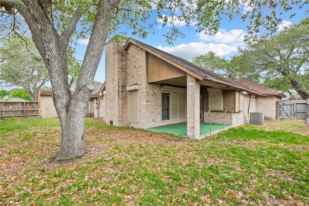 5309 Timbergate Drive Corpus Christi, TX 78413 - Photo 27 of 29 a view of a house with backyard and a tree