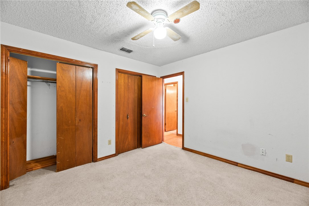 5309 Timbergate Drive Corpus Christi, TX 78413 - Photo 9 of 29 an empty room with closet and a chandelier fan