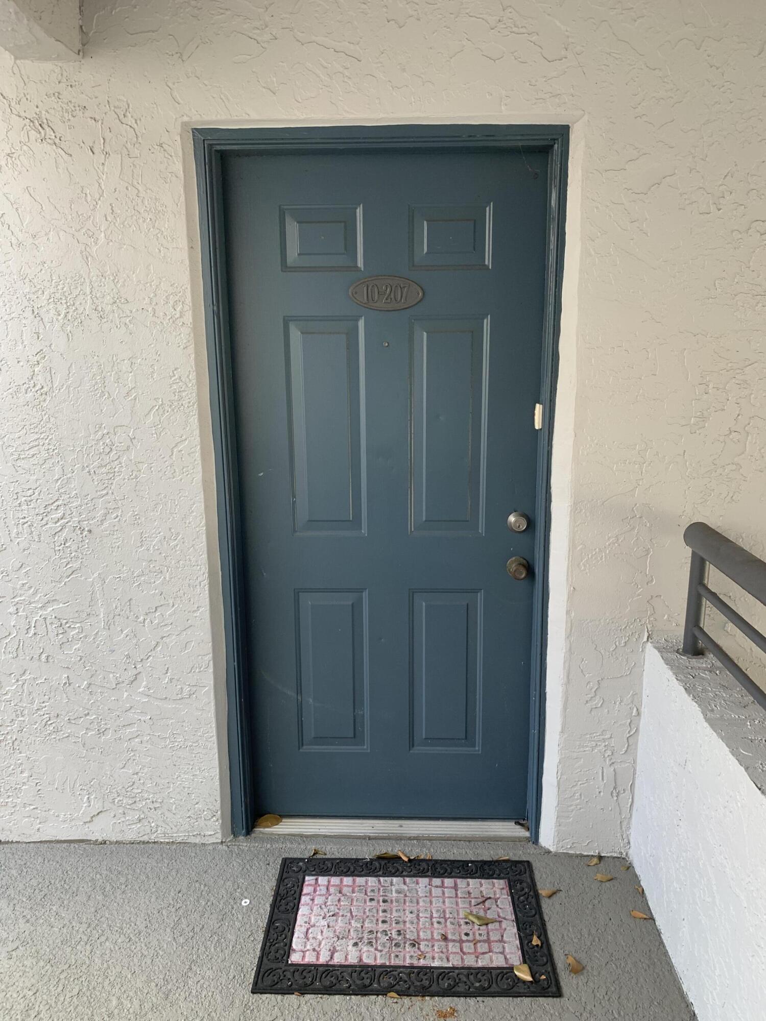 651 Lyons Road, Unit 10207 Coconut Creek, FL 33063 - Photo 1 of 38 a view of wooden door