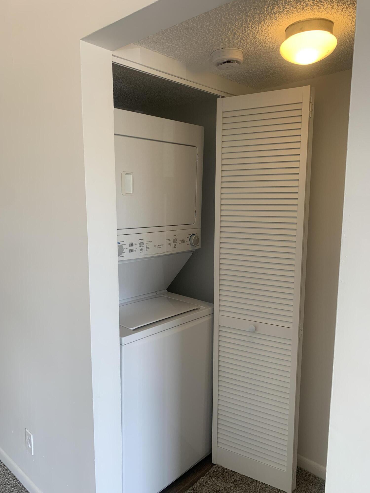 651 Lyons Road, Unit 10207 Coconut Creek, FL 33063 - Photo 13 of 38 Hallway from living room to bedroom, Was