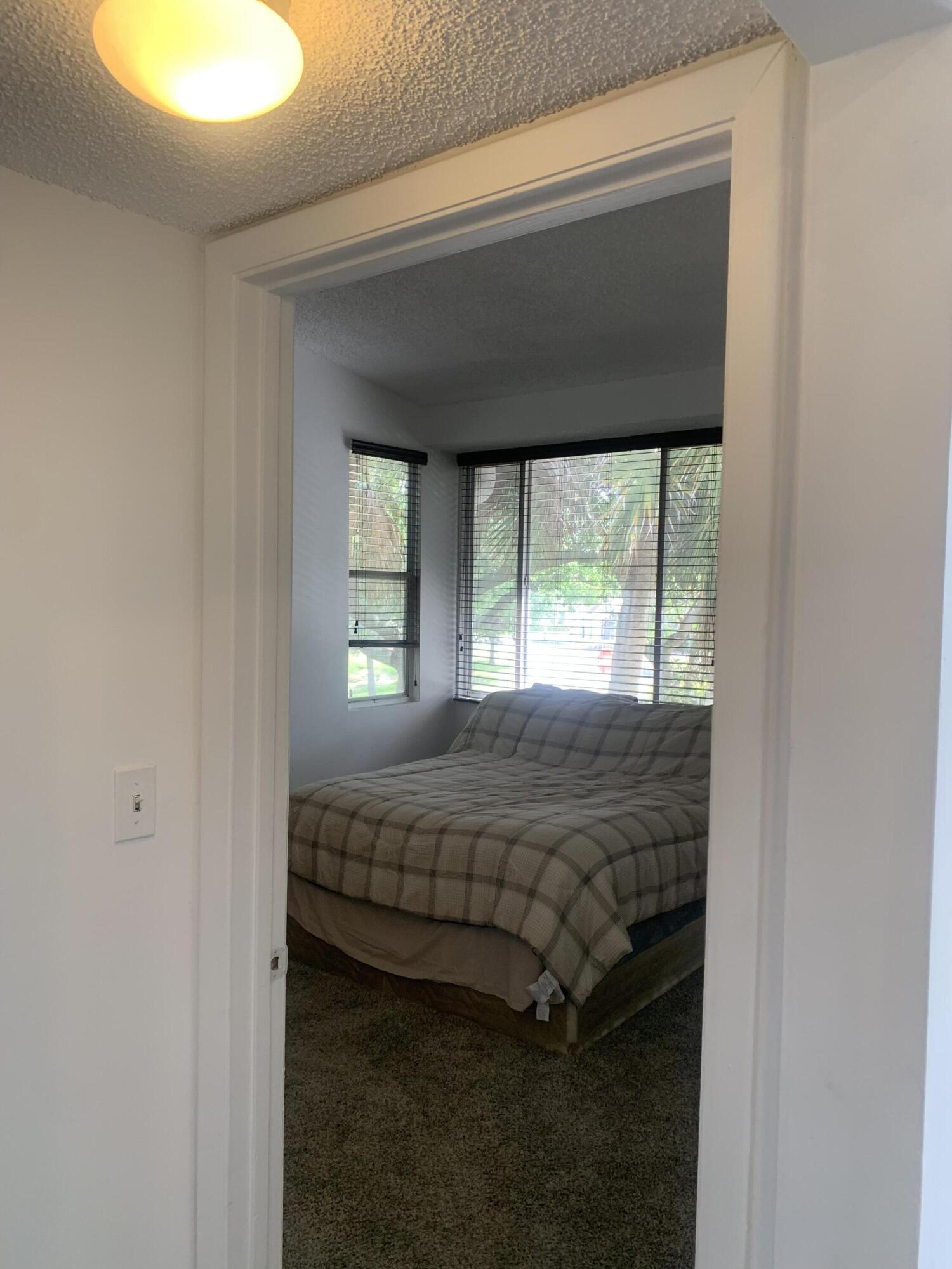651 Lyons Road, Unit 10207 Coconut Creek, FL 33063 - Photo 14 of 38 Primary bedroom