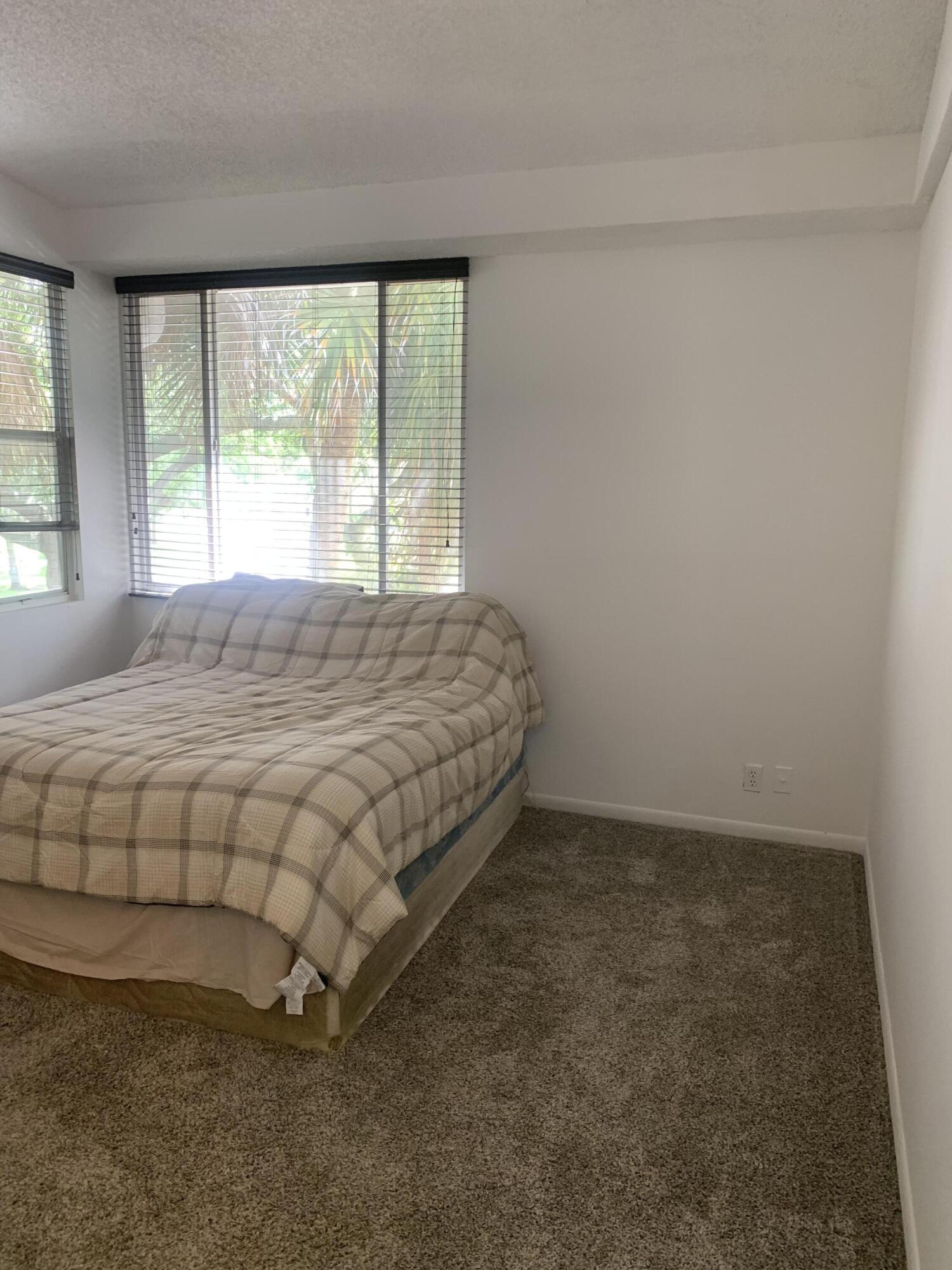 651 Lyons Road, Unit 10207 Coconut Creek, FL 33063 - Photo 15 of 38 Primary bedroom