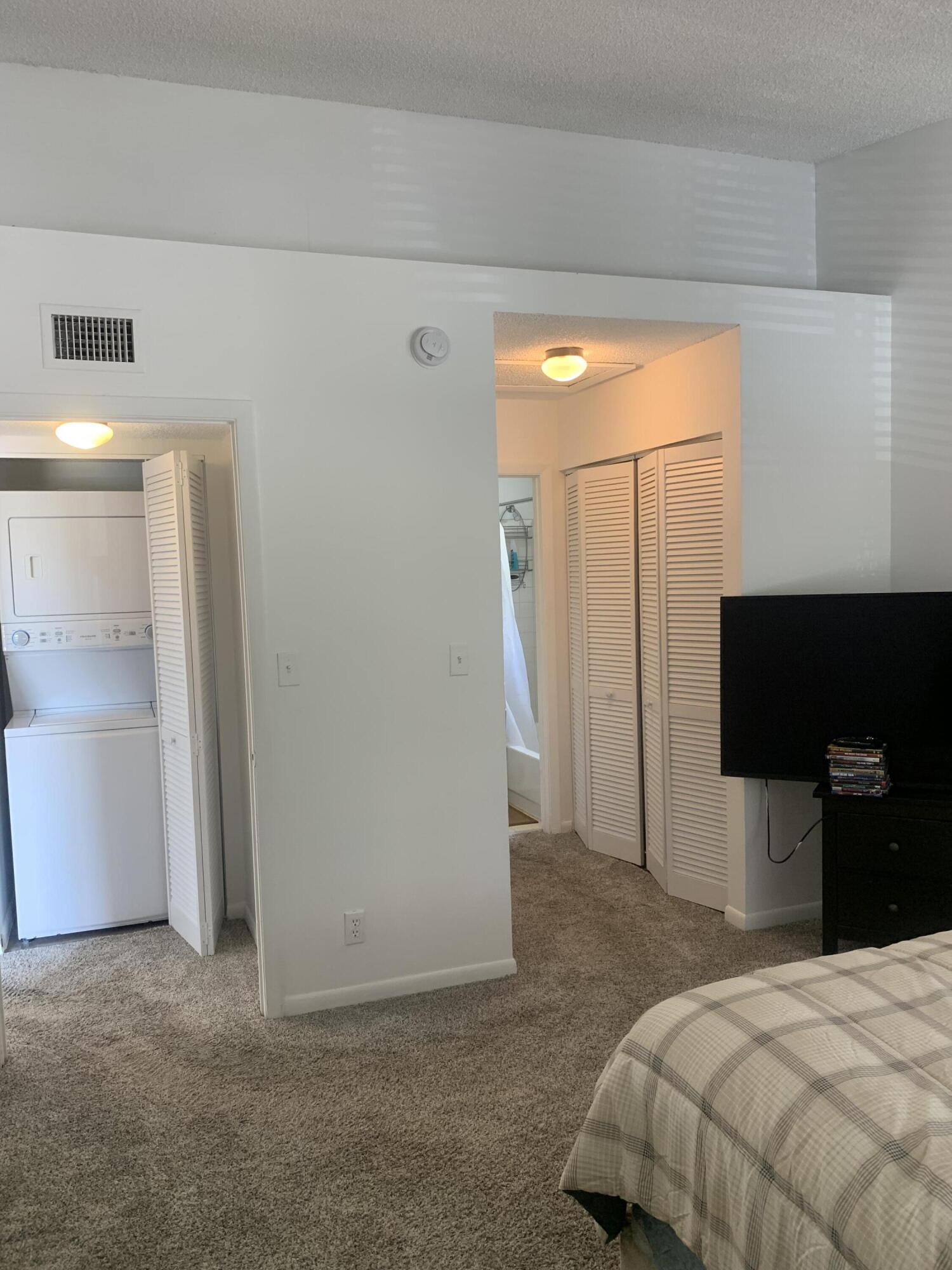 651 Lyons Road, Unit 10207 Coconut Creek, FL 33063 - Photo 16 of 38 Primary bedroom from different POV