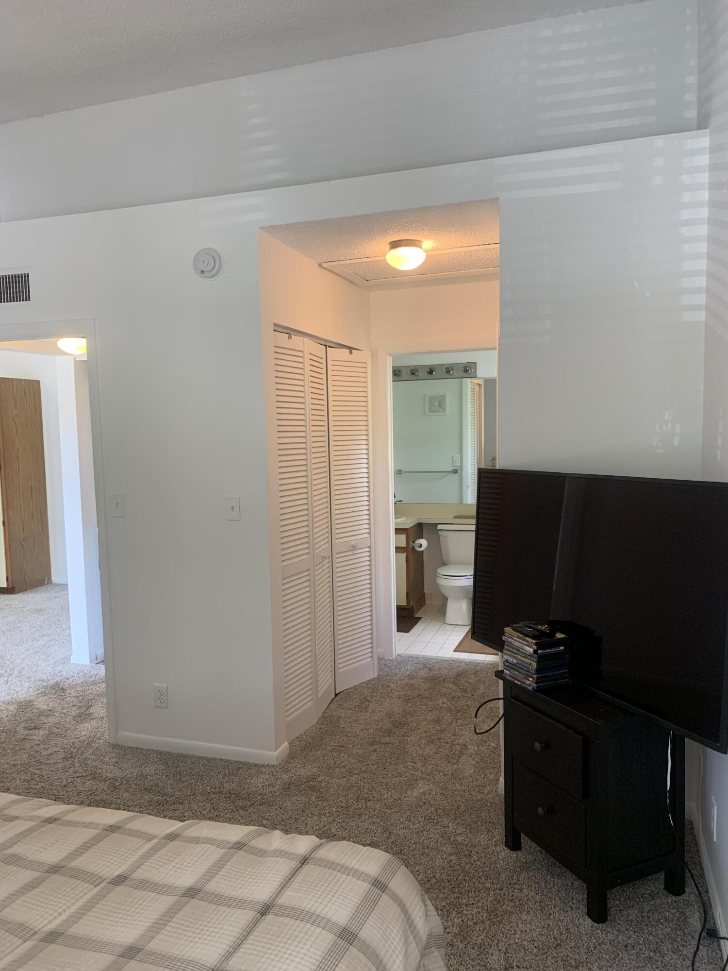 651 Lyons Road, Unit 10207 Coconut Creek, FL 33063 - Photo 17 of 38 Primary Bedroom different POV