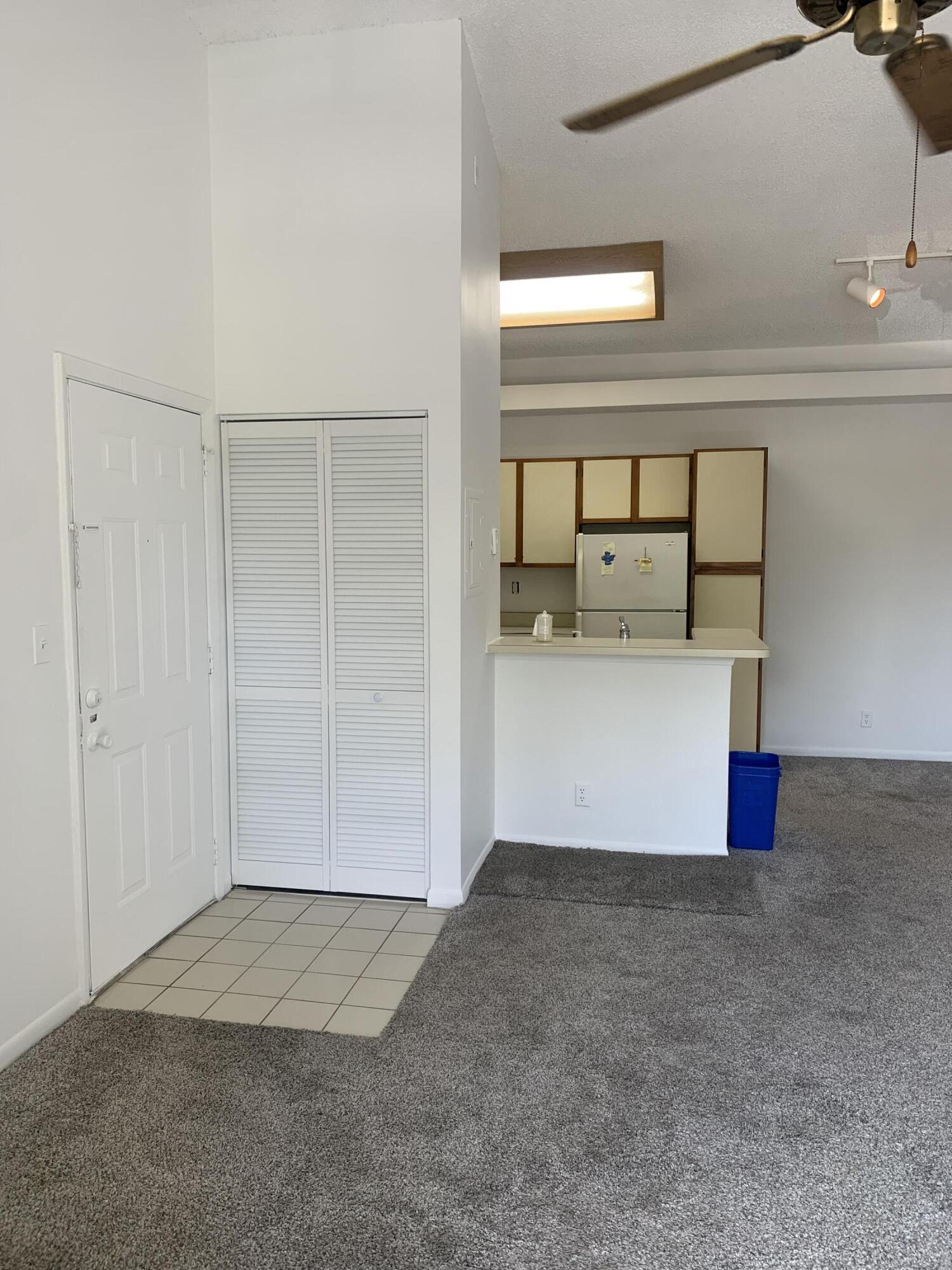 651 Lyons Road, Unit 10207 Coconut Creek, FL 33063 - Photo 2 of 38 Front door, entry closet