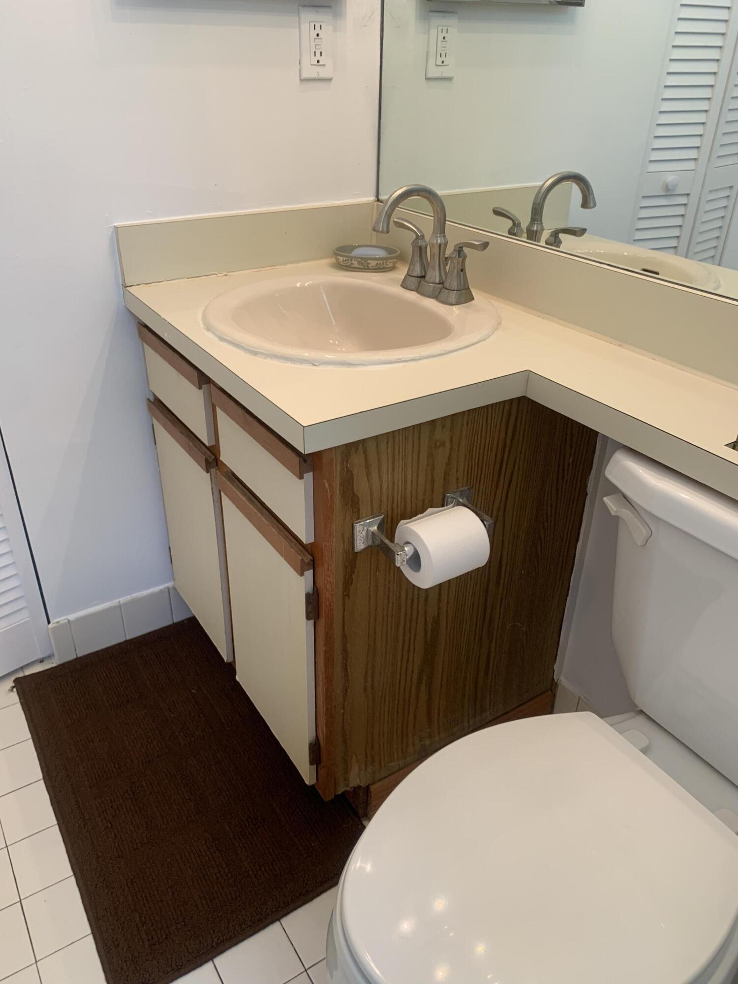 651 Lyons Road, Unit 10207 Coconut Creek, FL 33063 - Photo 24 of 38 Bathroom vanity and toilet