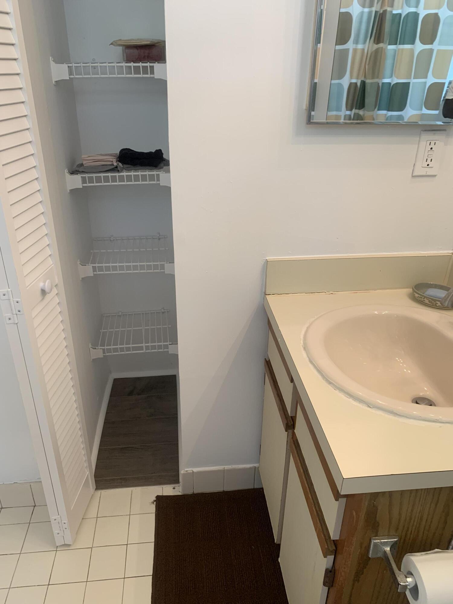 651 Lyons Road, Unit 10207 Coconut Creek, FL 33063 - Photo 29 of 38 Bathroom closet