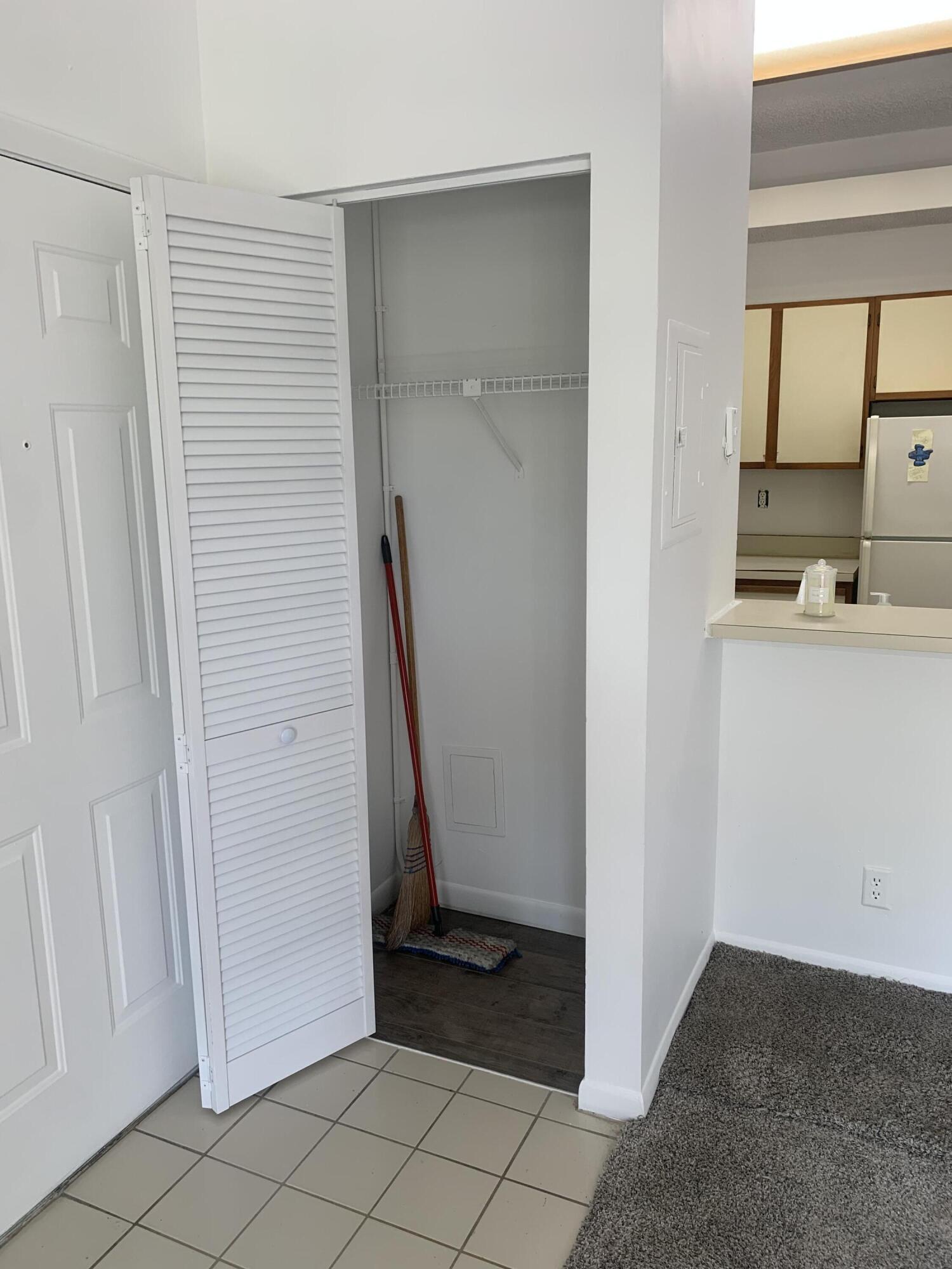 651 Lyons Road, Unit 10207 Coconut Creek, FL 33063 - Photo 3 of 38 Entry closet