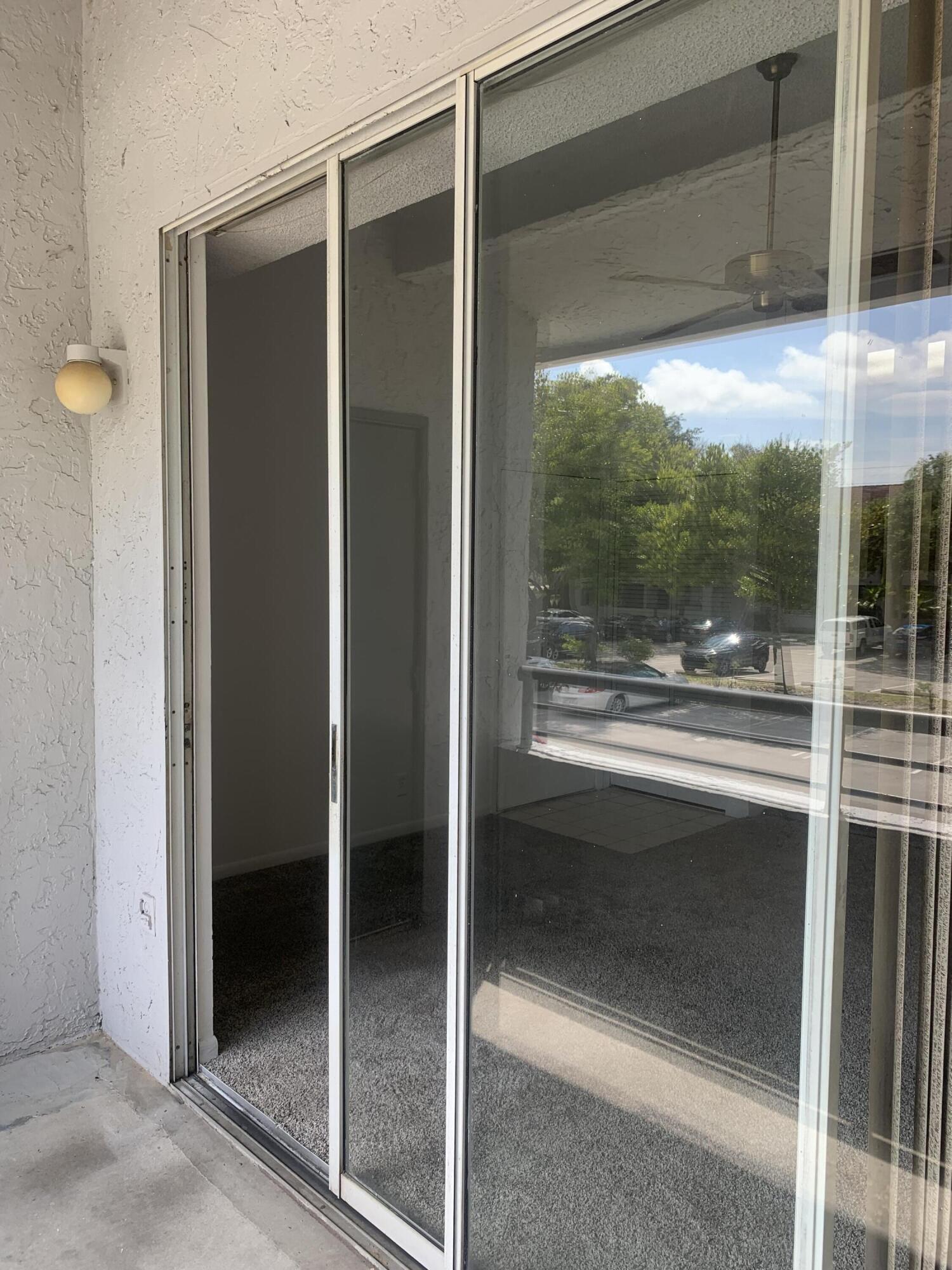 651 Lyons Road, Unit 10207 Coconut Creek, FL 33063 - Photo 31 of 38 Balcony Sliding glass door