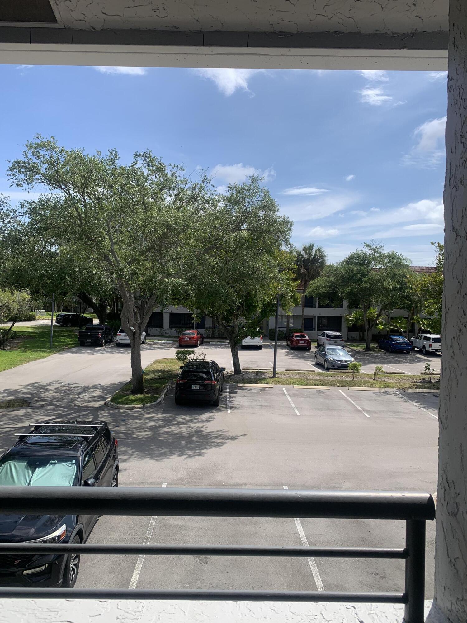 651 Lyons Road, Unit 10207 Coconut Creek, FL 33063 - Photo 36 of 38 Balcony view of parking lot