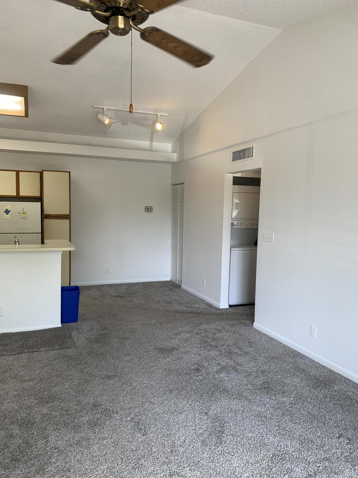 651 Lyons Road, Unit 10207 Coconut Creek, FL 33063 - Photo 4 of 38 Living room and dining area view