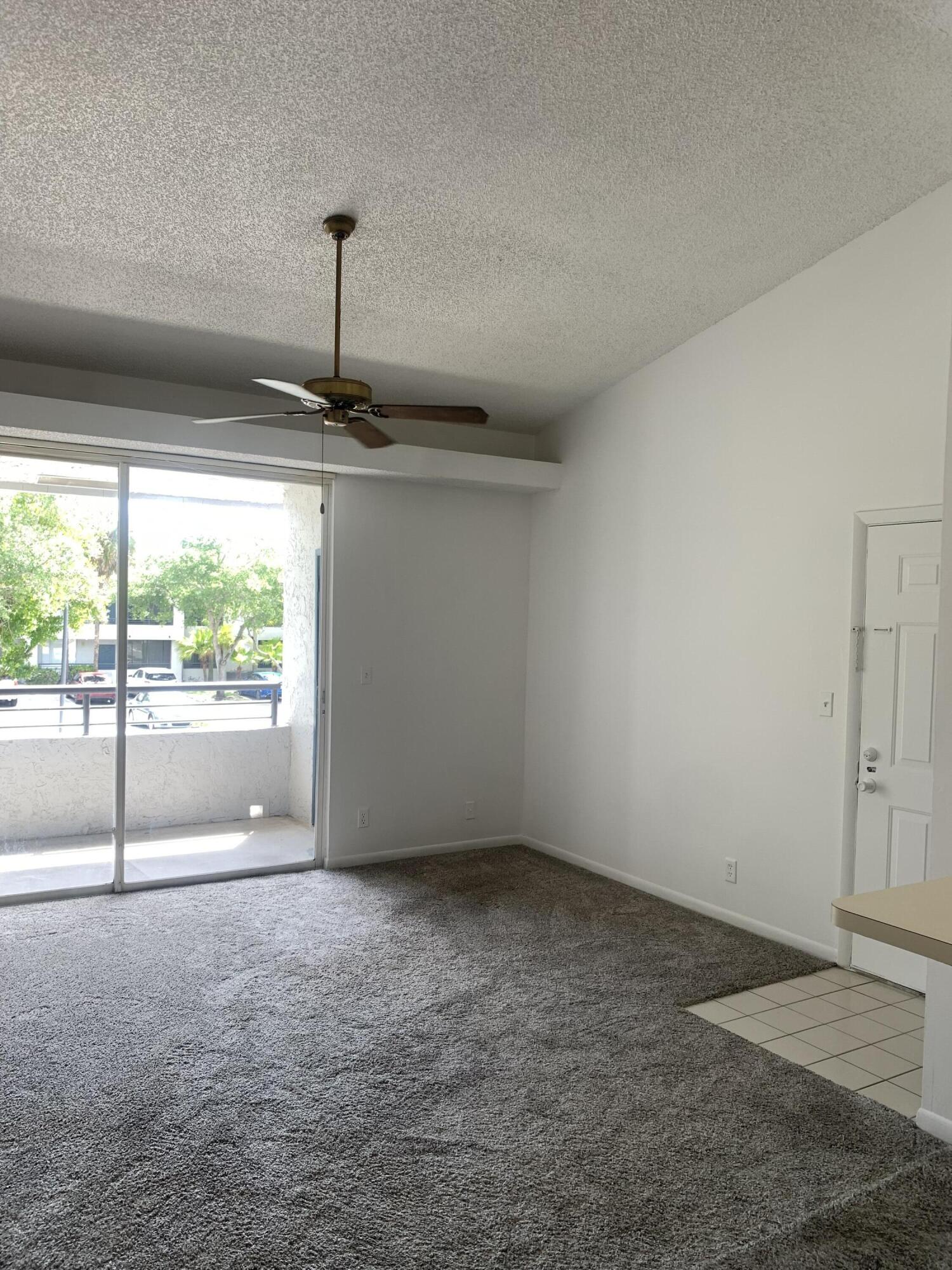 651 Lyons Road, Unit 10207 Coconut Creek, FL 33063 - Photo 6 of 38 View from dining room facing living room
