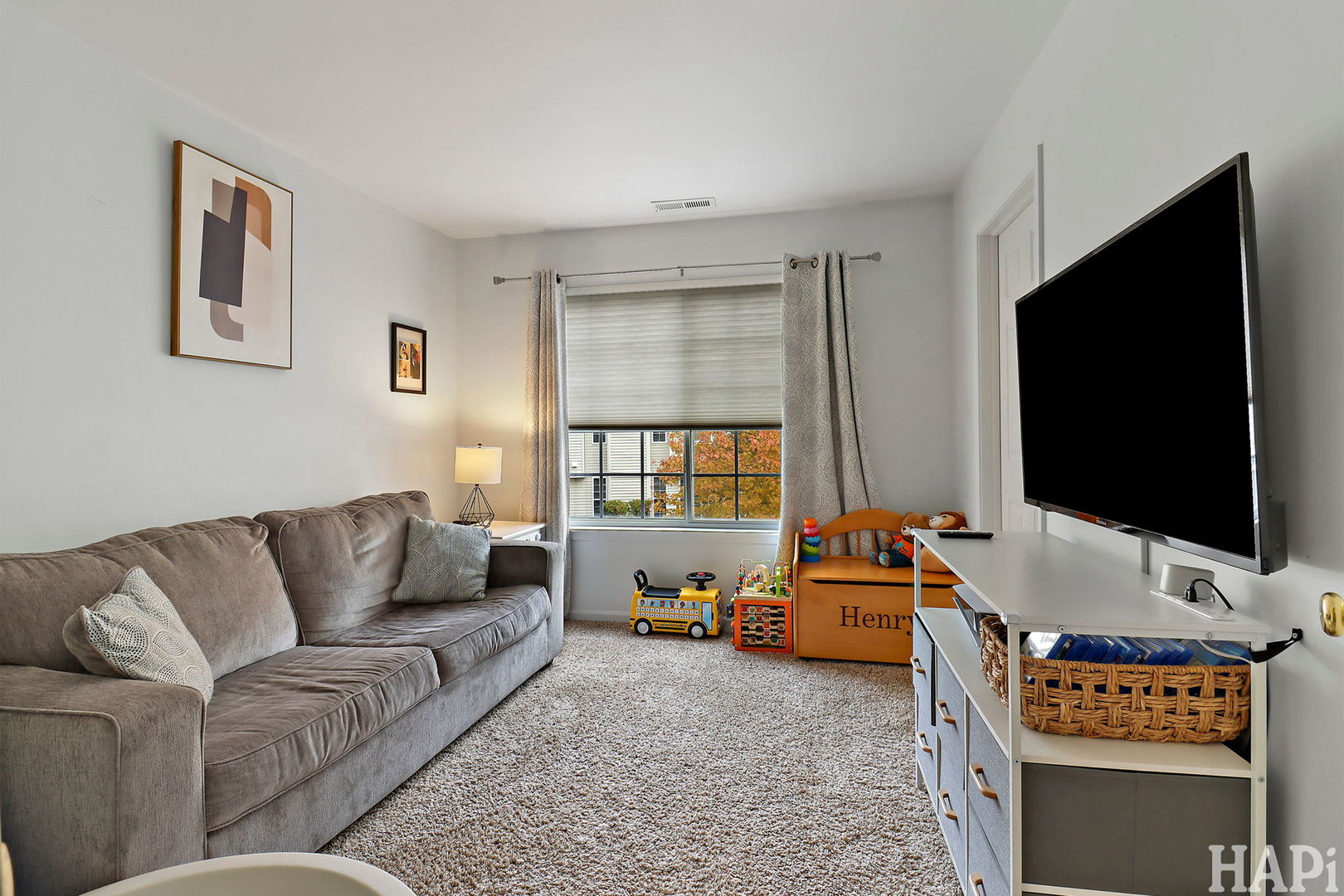 2154 Daybreak Drive Lake In The Hills, IL 60156 - Photo 13 of 29 a living room with furniture and a flat screen tv