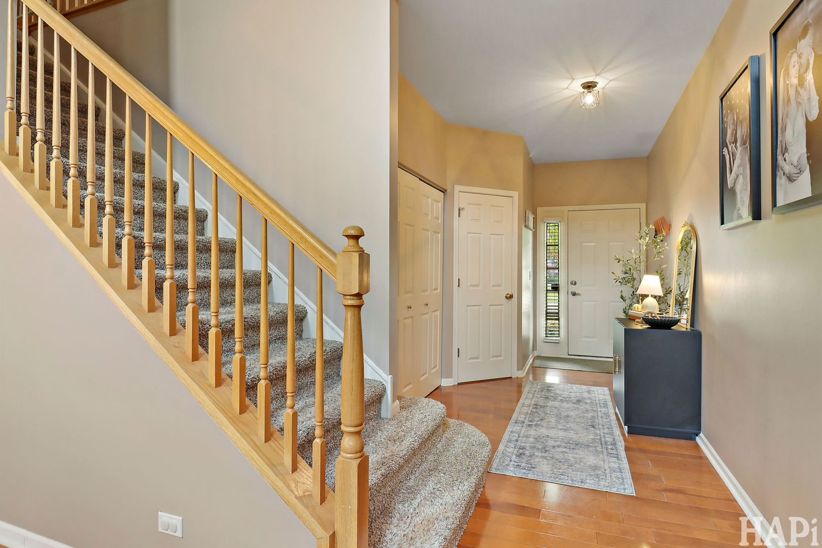 2154 Daybreak Drive Lake In The Hills, IL 60156 - Photo 2 of 29 a view of an entryway with wooden floor and stairs