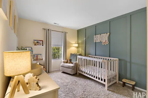 a bed room with a bed and a window