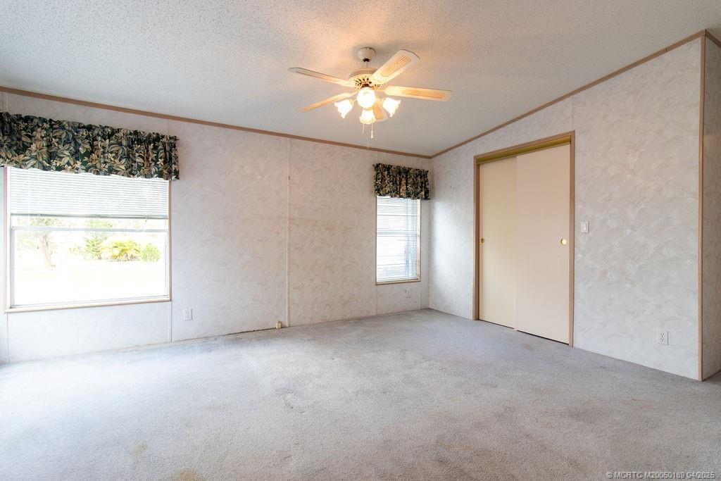 2500 Southwest Marquis Terrace Stuart, FL 34997 - Photo 14 of 20 wooden floor in an empty room with a window